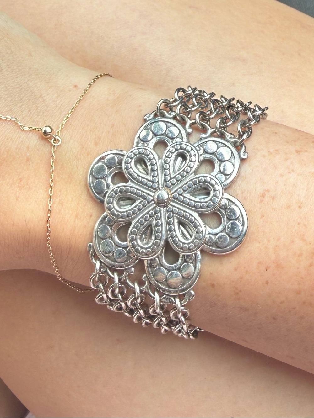 Sterling silver flower bracelet with cute detailing on side